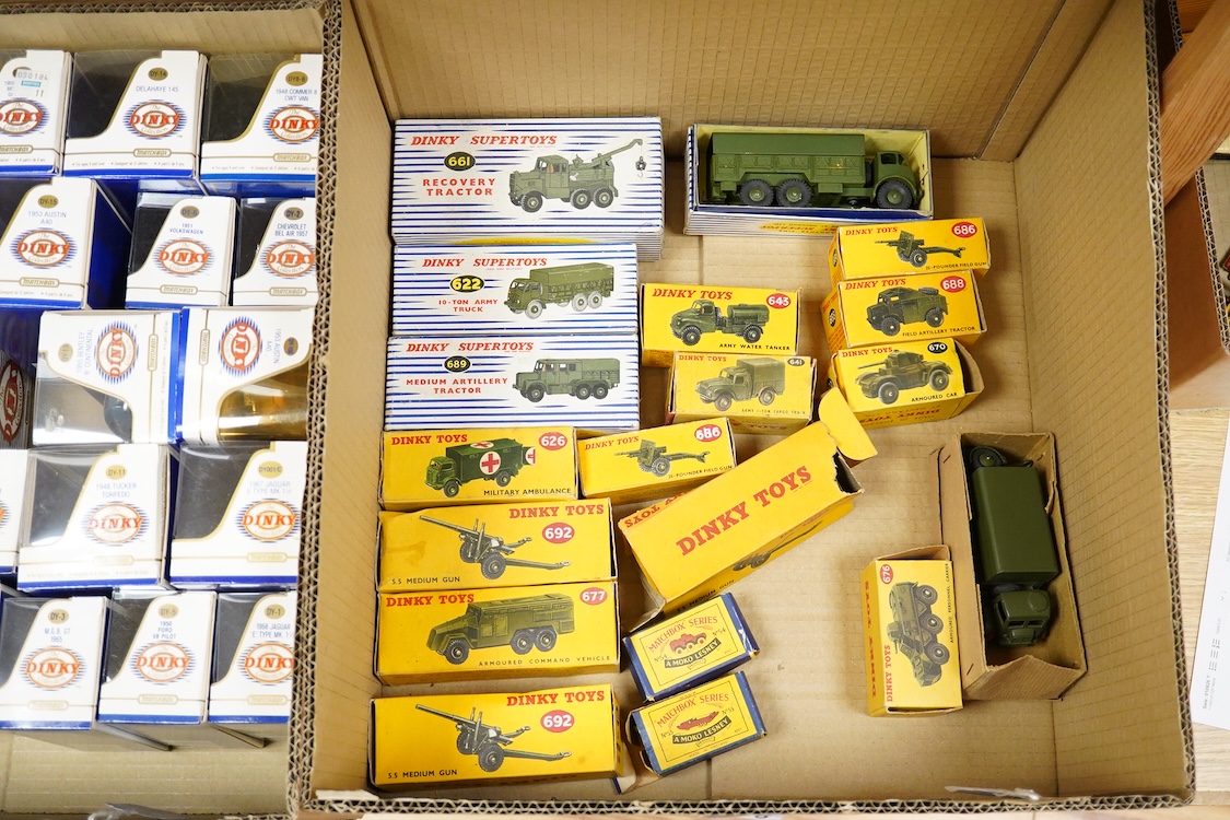 Fifteen boxed military Dinky Toys and Supertoys including; Recovery Tractor (661), 10-ton Army Truck (622), Military Ambulance (626), Army Water Tanker (643), etc. plus three unboxed vehicles, together with two Matchbox